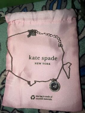 kate spade silver-tone pendant necklace with pink pouch